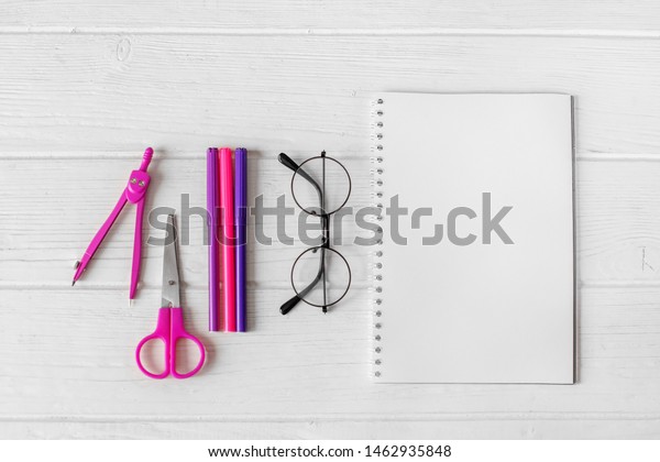 Pink and purple items for\
creativity and glasses. The concept of school, creativity,\
childhood and work.