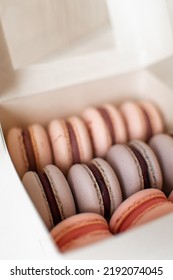 Pink And Purple Macarons In Kitchen