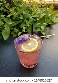 Pink And Purple Rock Candy Cocktail With Vines Vertical