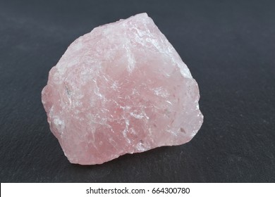 Pink quartz on a black stone board