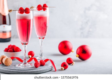 Pink Raspberry Mimosa Cocktail with champagne or prosecco for New Year