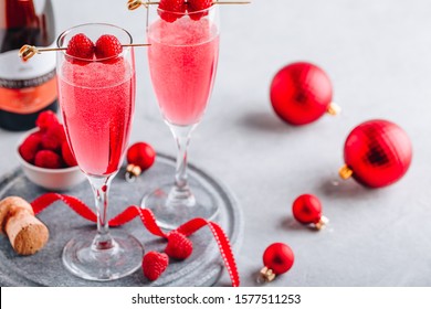 Pink Raspberry Mimosa Cocktail with champagne or prosecco for New Year