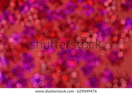 Pink and red abstract bokeh background.