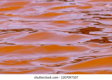 Pink Red Colours Of Sea Water During The Salt Harvesting Process. The Pink Colour Is Caused By Halobacteria That Thrive In The Increase Saline Conditions