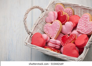 Pink And Red Heart-shaped Cookies In A Square Wicker Basket Close-up