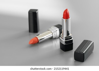 Pink And Red Lipsticks On Vanity Table