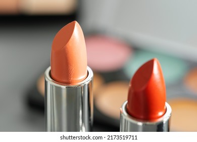 Pink And Red Lipsticks On Vanity Table