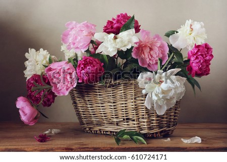 Similar – Woman decorated large bouquet of flowers with roses in vase