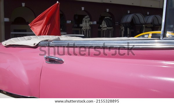Pink retro\
convertible door, Cuba,\
Havana