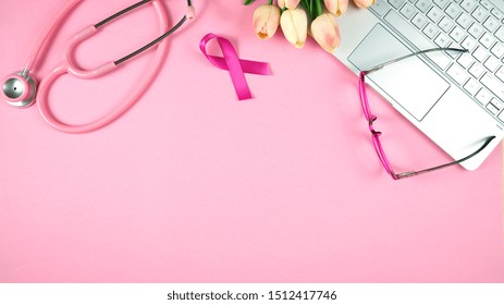 Pink Ribbon Breast Cancer Awareness concept with female pink doctors desk concept, with copy space. - Powered by Shutterstock