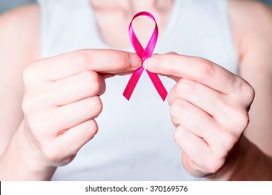 Pink ribbon of breast cancer. Awareness, charity campaign. Symbol of health or illness, support, hope or help. Cause of woman, female disease, survivor. Healthcare or medicine.