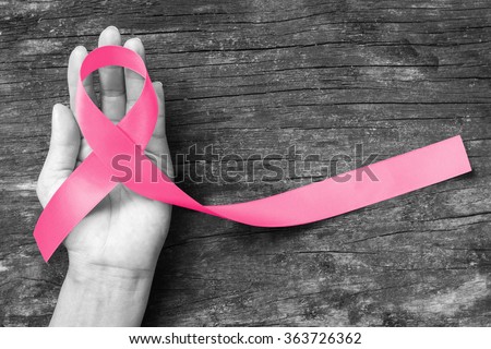 Pink ribbon for breast cancer awareness, symbolic bow color raising awareness on people living with women's breast tumor illness (bow isolated with clipping path)