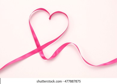 Pink Ribbon Heart On White Background.