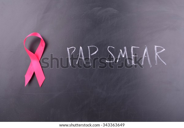 Pink Ribbon on a blackboard Symbolising Women\
Health Issues of Pap Smear