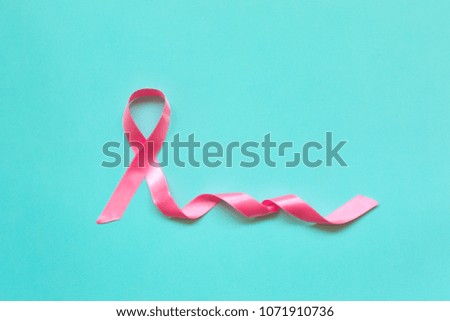 Pink ribbon on a blue background. Breast cancer awareness month. Cancer concept