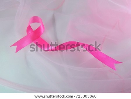 Pink ribbon on soft fabric . Breast Cancer Awareness Month Concept