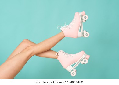 Pink roller skates on the legs. Activity can be fun! - Shutterstock ID 1454945180