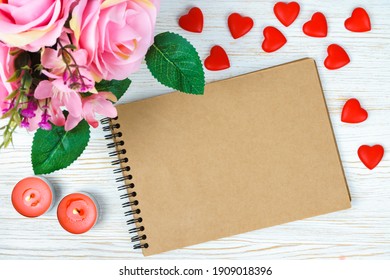 Pink Rose Bouqet And Red Heart On White Wooden Background.