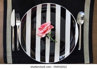 Pink Rose flower on Plate background Hipster Valentine dinner concept