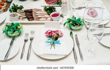 Pink Roses With Blue Ribbon On White Empty Plate With White Napkin On Dinner Table. Table Setting. Table Served For Wedding Banquet, Close Up View