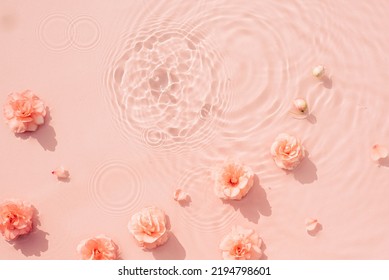 Pink roses, drops and waves on surface of the water. Water abstract background - Shutterstock ID 2194798601