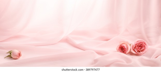 pink roses on soft silk - Shutterstock ID 389797477