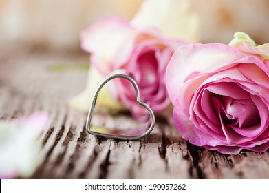 Pink roses and a sweet little heart