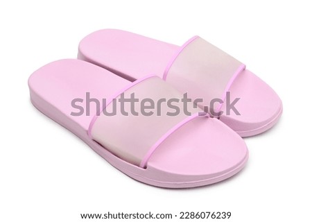 Pink rubber slippers on white background
