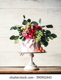 Pink Rustic Wedding Cake With Flowers On White Background