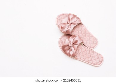 Pink Satin Female Glamorous Home Slippers With Bows Isolated On A White Background. Top View
