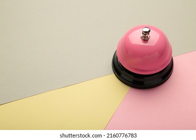 Pink Service Bell On Pastel Colorful Background. Top View