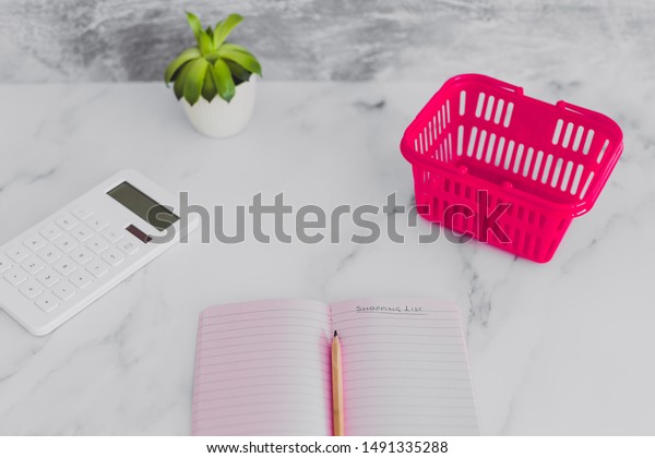 Pink Shopping Basket On Marble Desk Royalty Free Stock Image