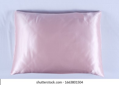 
Pink Silk Pillowcase On A Pillow Close-up