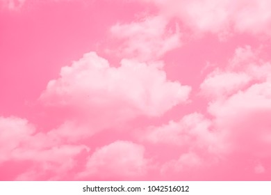 Pink Sky Background With White Clouds.