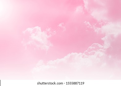 Pink sky background with white clouds. twilight purple and pink colors. pink pattern. pink textured background
