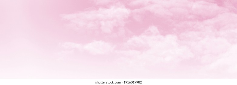 Pink sky background and white clouds background. The sky before a large storm. Pink Sweet dream.