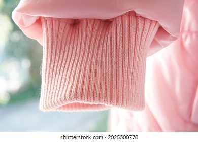 Pink Sleeve Of Jacket Or Sweater, Cuff For Sealing. Narrowing Sleeves On A Light Background, Magky Selective Selective Focus