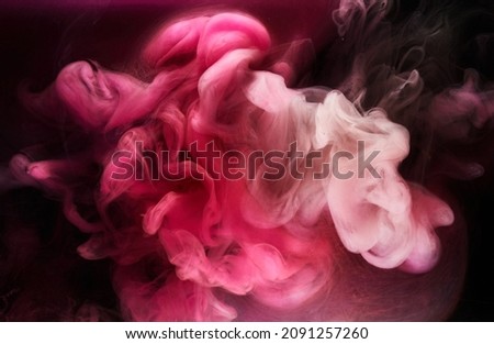 Pink smoke on black ink background, colorful fog, abstract swirling touch ocean sea, acrylic paint pigment underwater