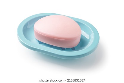 Pink Soap Bar In A Teal Blue Dish Isolated On A White Background. Oval Shaped Bar Of Soap On A Plastic Holder For Bathroom And Shower. Purity, Toiletries And Washing Hands Concepts. Top View.