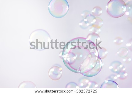 Pink soap bubbles float background