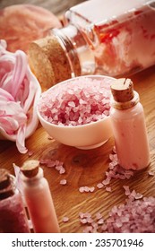 Pink spa still life with flower petals on wooden background - Shutterstock ID 235701946