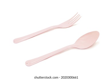 Pink Spoon And Fork Isolate On White Background