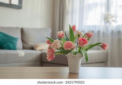 pink spring flowers in white ceramic vase in modern home interior - Powered by Shutterstock