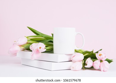 Pink Spring Tulips And A Blank White Mug Mockup Against A Pale Pink Background