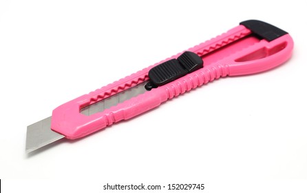 Pink Stationery Knife Or Box Cutter Isolated On White Background