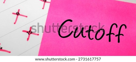 Pink sticky note with Cutoff text placed over a paper calendar with specific dates crossed out in red ink. Final deadline concept.