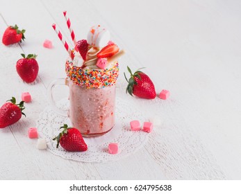 Pink strawberry freakshake with sweets