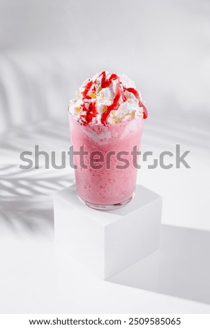 Similar – Image, Stock Photo Strawberry milkshake topped with whipped cream, minimalist on a green background