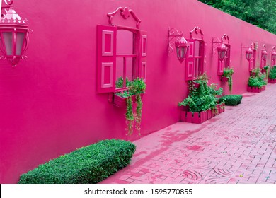 Pink Street With Green Plants, Windows, Street Lams, Decorative Caribbean Entourage In Old City Victorian Style, Puerto Plata, Dominican Republic.