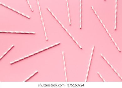 Pink Striped Straws On Pink Background